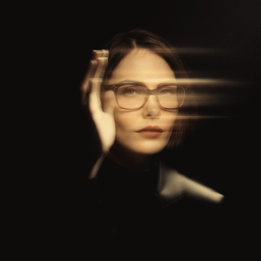 Anastasia, hand raised through the light